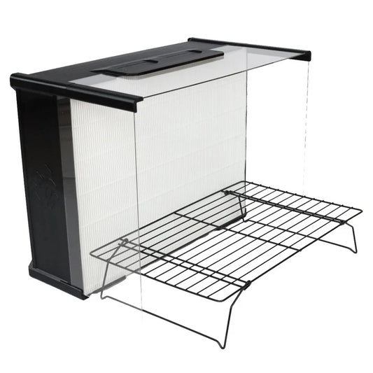 Black laminar flow hood, with a metal rack in front of it